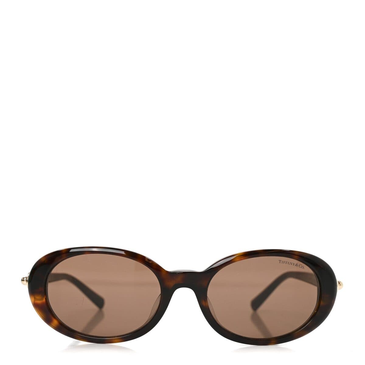Sunglasses on a warm neutral ground