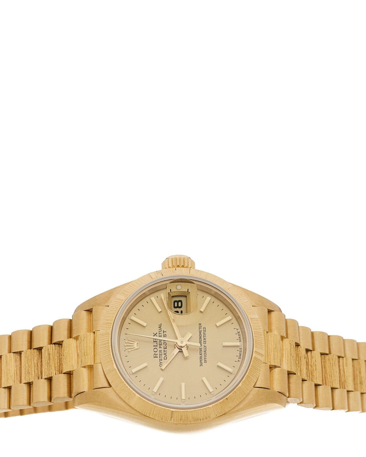 Two-tone dress watch photographed on a neutral ground